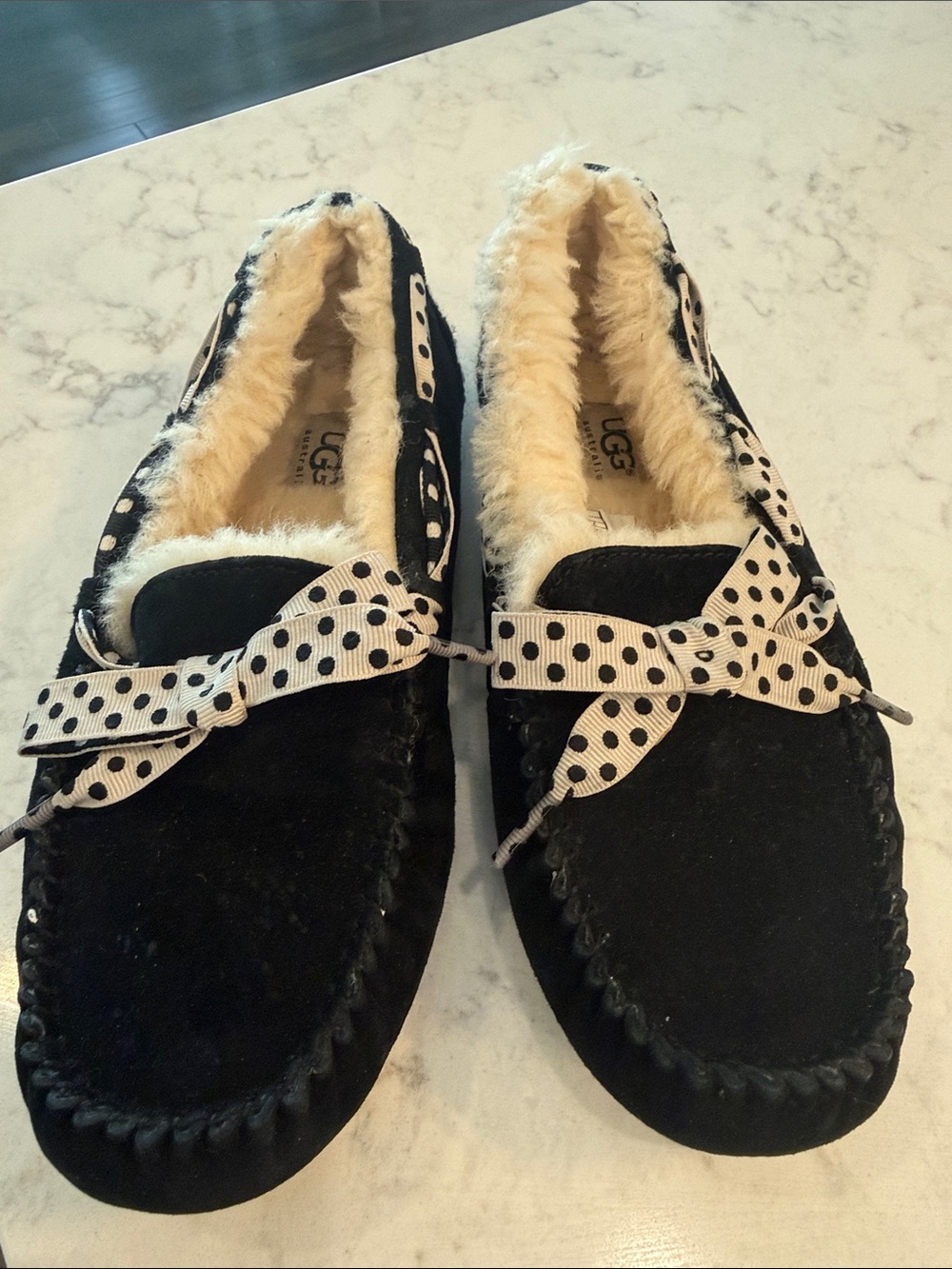 UGG Black Suede Moccasin Slippers with Cream Shearling and Polka Dot Bow